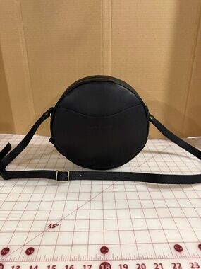 Portland Leather large round crossbody bag.